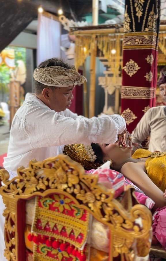 Traditional Balinese tooth filing ceremony details floral offerings